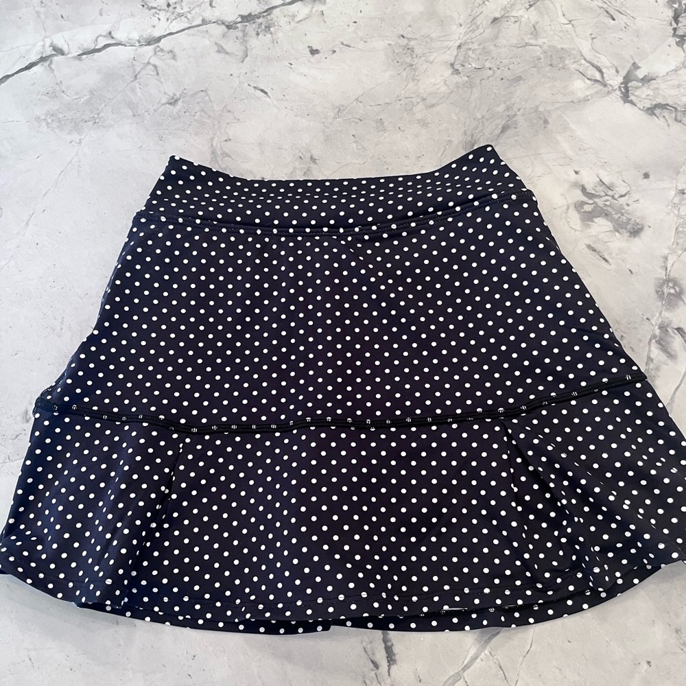 DonaJo Black and White polka dot tennis shirt size 1.